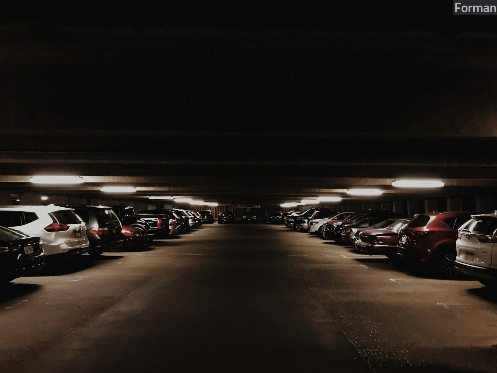 vehicles parked inside parking lot