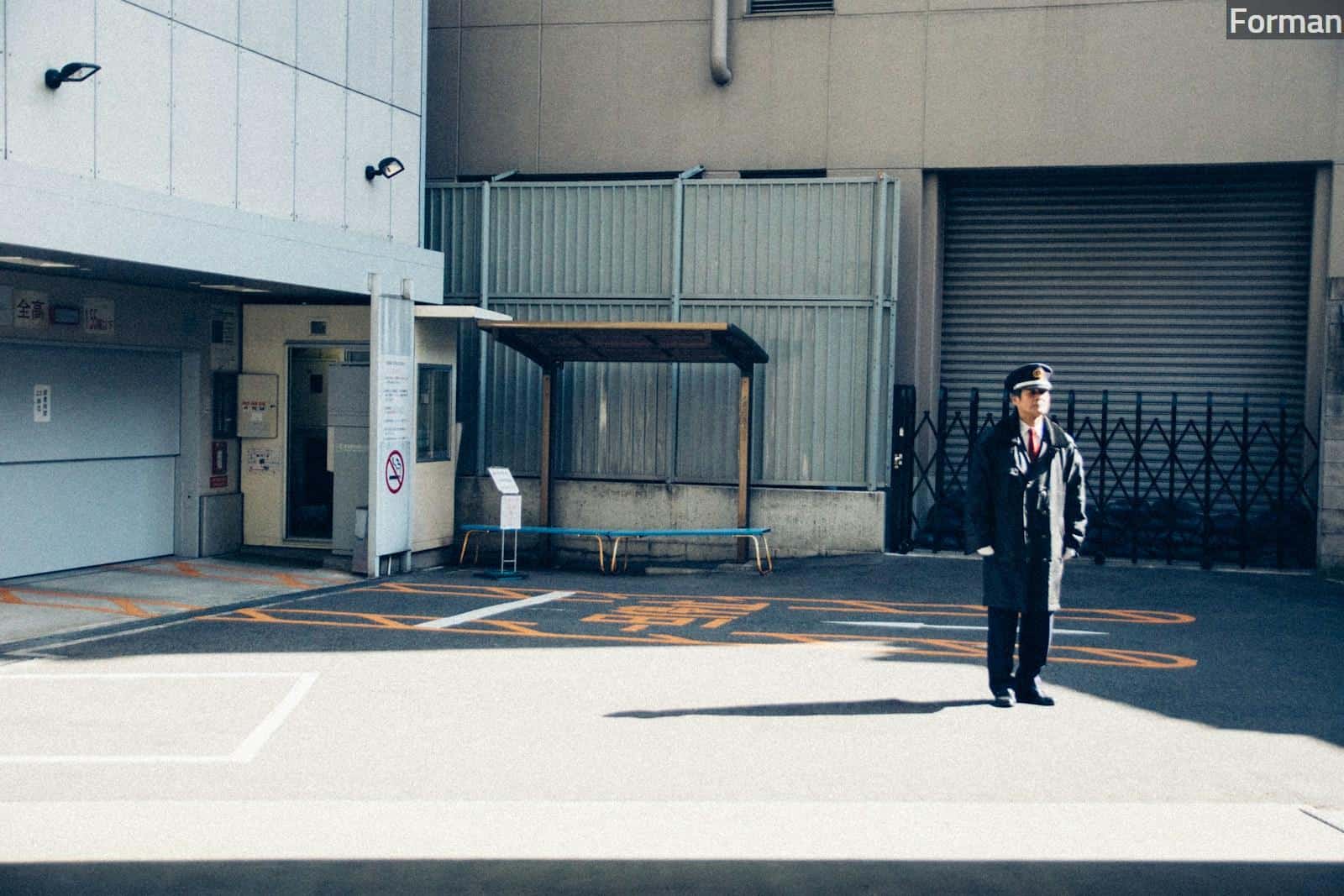 man standing near building